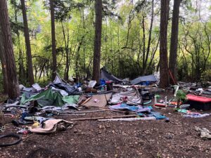 trash left behind at illegal encampment